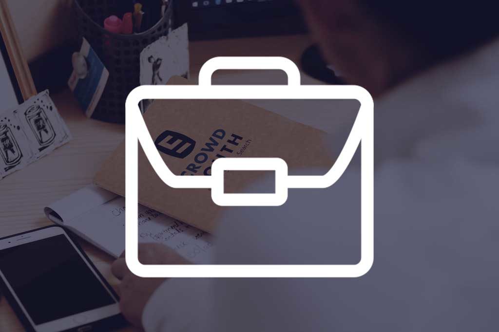 Briefcase Icon laid over background image of person at CrowdSouth doing work